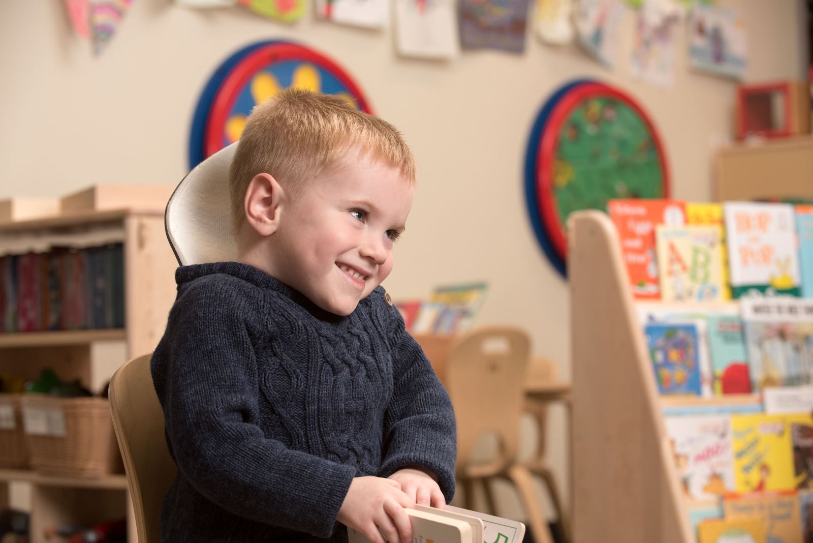 Young boy reading a book